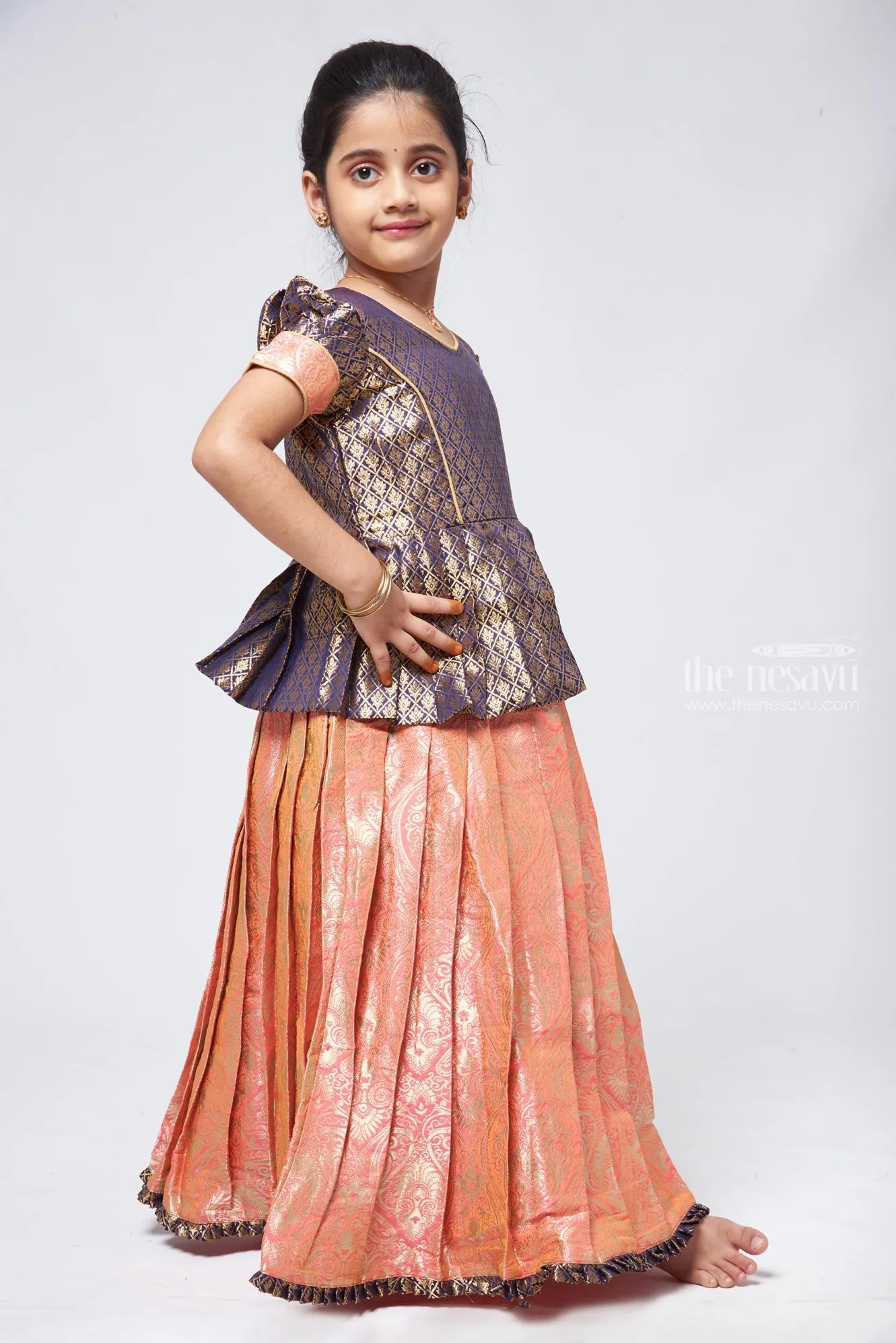 Classic Brocade Green Peplum Blouse with Banarasi Pink Pattu Pavadai: Traditional Festive Charm